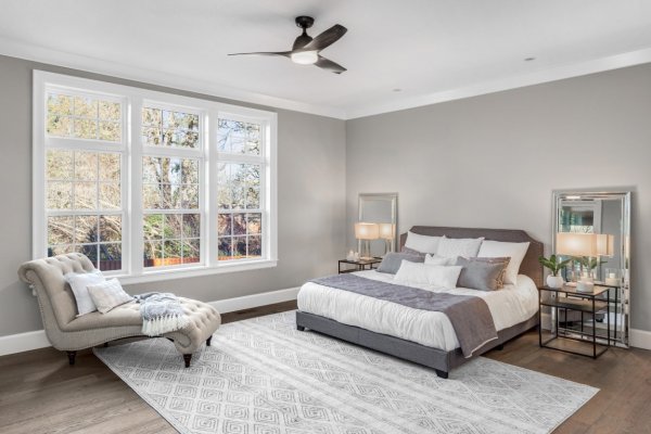 nice grey and white themed bedroom with lots of natural light 